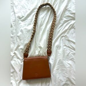 Crossbody purse with knitted strap